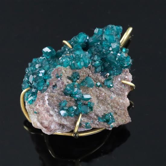 An Andrew Grima 18ct gold mounted diopside boulder pendant, stamped verso 0.750 Grima, gross weight 22.9 grams.